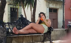 Nice legs and feet in the park (one of them showing little else)