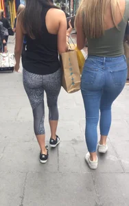 Sexy girl walking in grey patterned leggings with friend in tight jeans