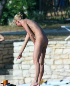 Sexy and skinny blonde nudist milf on the beach