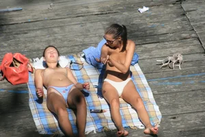 Two teens stripping and going topless to tan