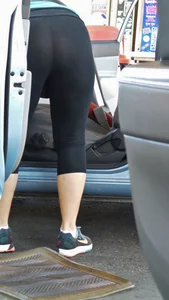 Girl in tight see through leggings with nice ass cleaning her car