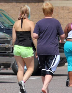 Blonde girl in glasses with a thick booty in green shorts