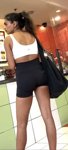 hot petite Indian chick showing some T&A in skimpy workout clothes