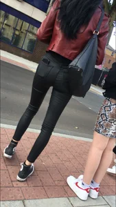 Chav brunette with a nice ass and vpl in tight black leather pants
