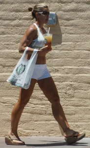 Fit babe in white shorts with big boobs in athletic top
