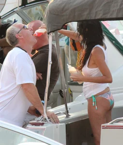 Bikini babe on a boat with a wet see through white shirt showing her tits