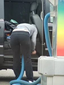 Girls cleaning their cars in jeans and pants