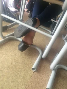 College teen in flats dangling her shoes under desk in class creepshots
