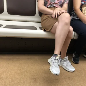 Amazing Hot Girl in a Skirt and Sneakers Sitting Cross-Legged in the Subway Train and on the Escalator Candid Photos Gallery