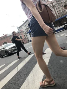Young Girl in Shorts And Sandals Crossing the Street Gallery