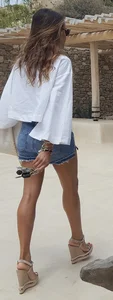 Flat ass leggy girl in denim shorts