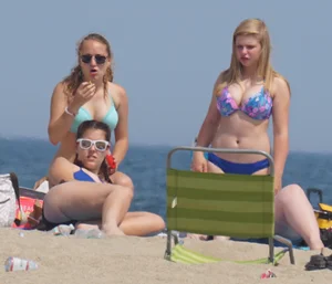 3 girls on the beach in bikinis with big boobs, one brunette and two blondes