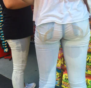 Girl in wet jeans making them semi see through