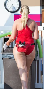 Thick blonde lifeguard in red swimsuit