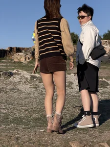 Hot Asian chick wearing mini shorts with her butt cheeks visible