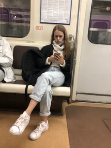 Cute and grumpy looking candid girl wearing jeans in subway creepshots