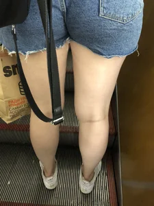 Hot Booty In Blue Jean Shorts And Chunky Legs Creepshots Gallery on a Subway Escalator