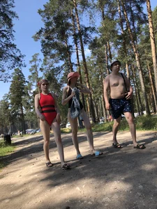 Young Girl in a One-Piece Swimsuit Walking on a Forest Road Photo Gallery