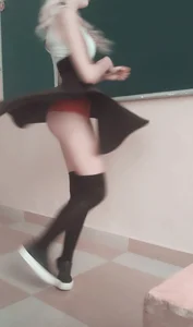 Blonde Girl in a Dress and Knee Socks Spinning Cute Candid