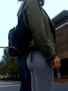 College girl in striped leggings walking with nice ass