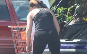 Redhead milf with a nice ass and vtl in leggings while loading her car