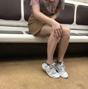 Amazing Hot Girl in a Skirt and Sneakers Sitting Cross-Legged in the Subway Train and on the Escalator Candid Photos Gallery
