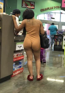Latina with hard nipples and a big booty in tight spandex shorts outfit