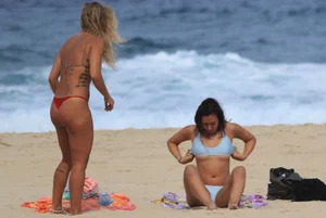 Sexy girls topless on a nude beach showing their nice tits