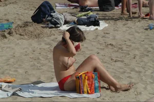 Girls on a nude beach in Sitges, Spain