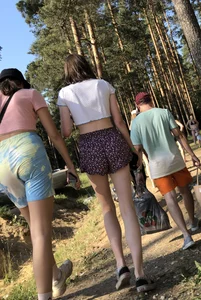 Skinny Teens in Shorts and a Top Walking on a Forest Road Photo Gallery