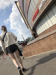 Cute candid teen with pale slim legs in shorts