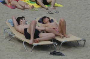 Topless girls on a beach in Barcelona