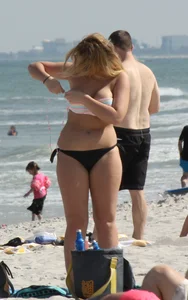 Big boobed thick blonde on the beach in a bikini