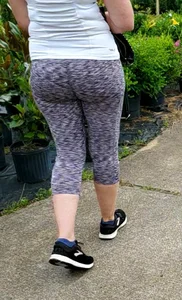 Milf booty in tight leggings shopping for plants