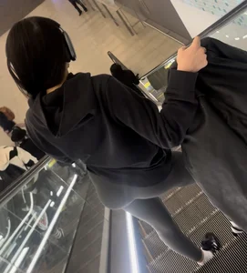 Tight curvy latina at airport pulls up pants