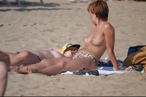 Girls on a nude beach in Bibione, Italy