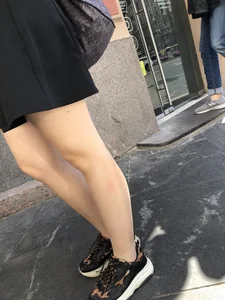 Very nice legs of a candid girl wearing a skirt
