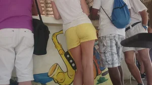 Milf in yellow shorts with vpl and a wedgie