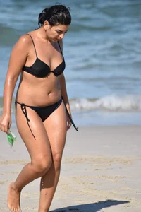 Thick mature brunette bikini lady on the beach with a nice body