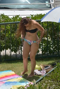 Chick with great body laying out in thong bikini