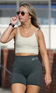 Blonde woman in lycra shorts - good front view, back view ruined by a bag