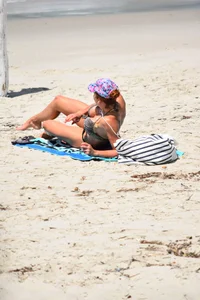 Redhead with nice tits in a bikini on the beach
