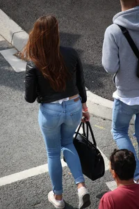 Pretty redhead in tight jeans with a nice booty