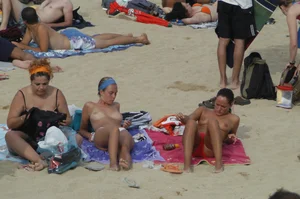 Topless girls on a beach in Barcelona
