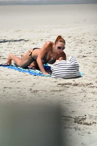 Redhead with nice tits in a bikini on the beach
