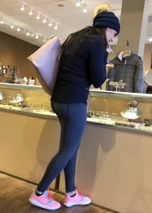 Brunette jewelry shopping in leggings with a nice ass
