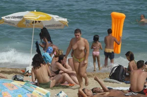 Topless girls on a beach in Barcelona