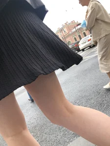Closeups of a candid girl's legs on a crosswalk