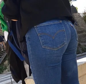 Two beautiful teens in jeans. One white and one blue jeans