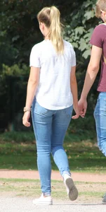 Blonde chick walking with her boyfriend in tight jeans